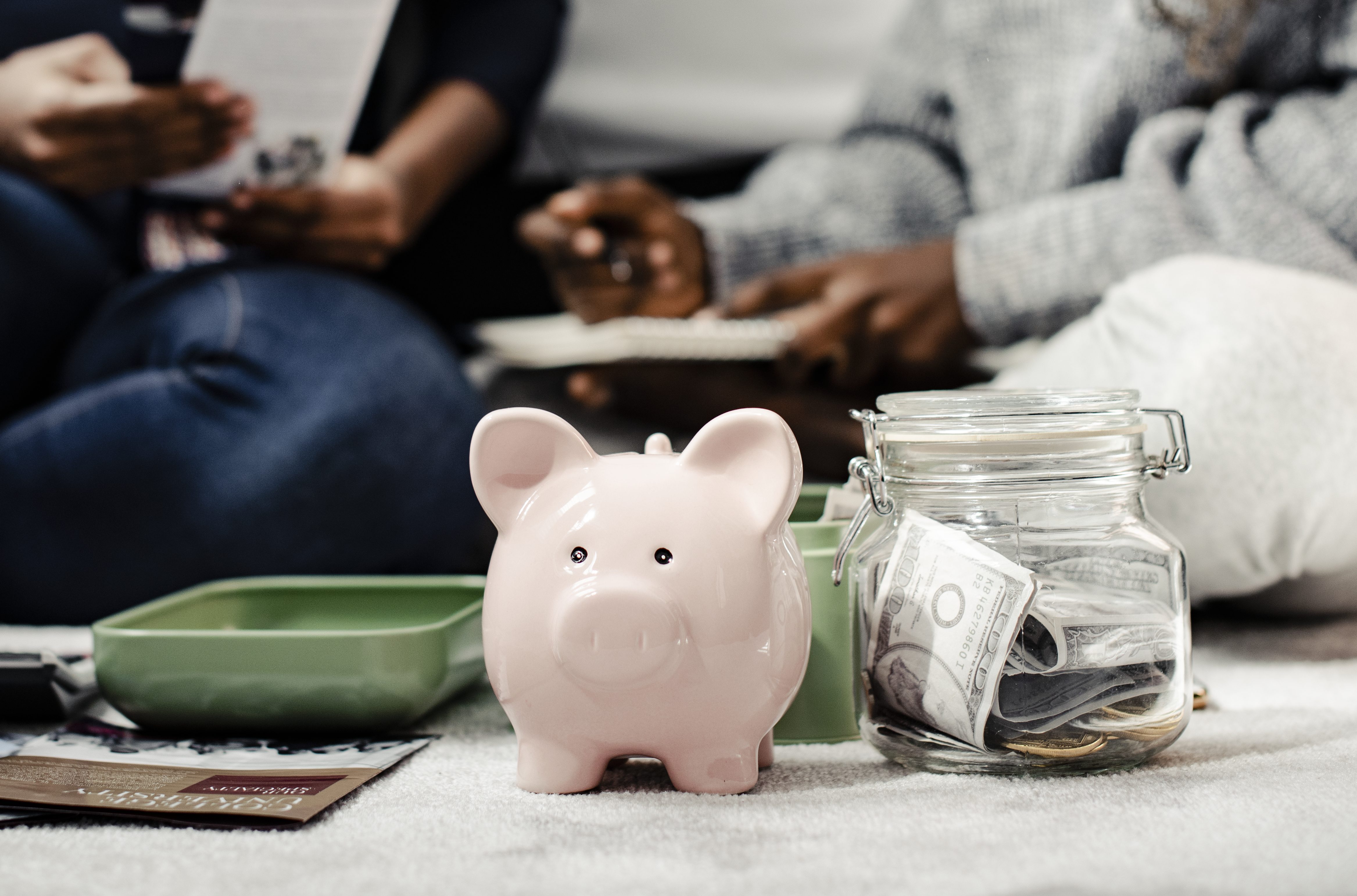 Mother teaching her daughter about savings