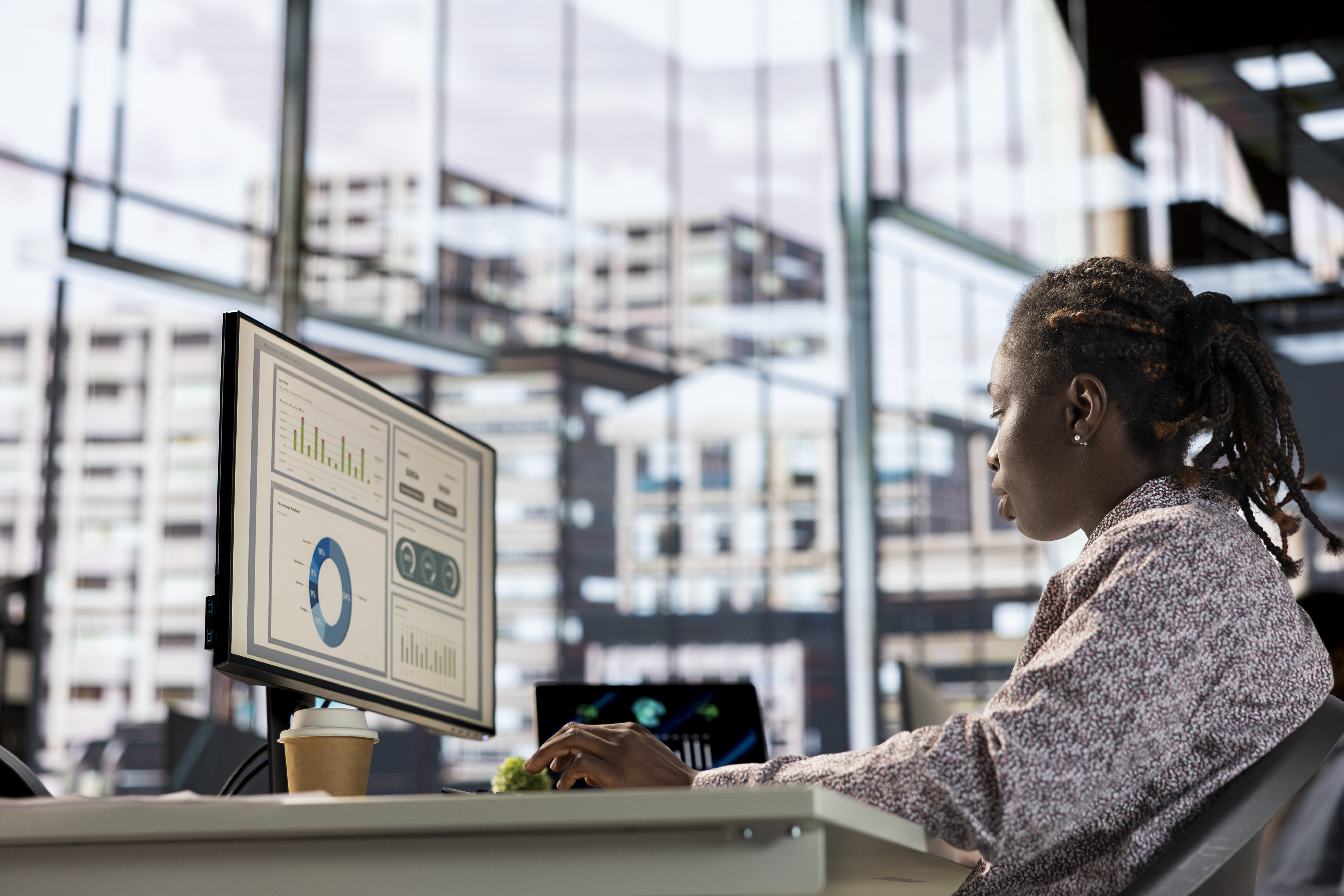 African american manager analyzing company data for strategic planning, solving resource allocation and effective business operations. Expert does financial forecasting and data analysis.