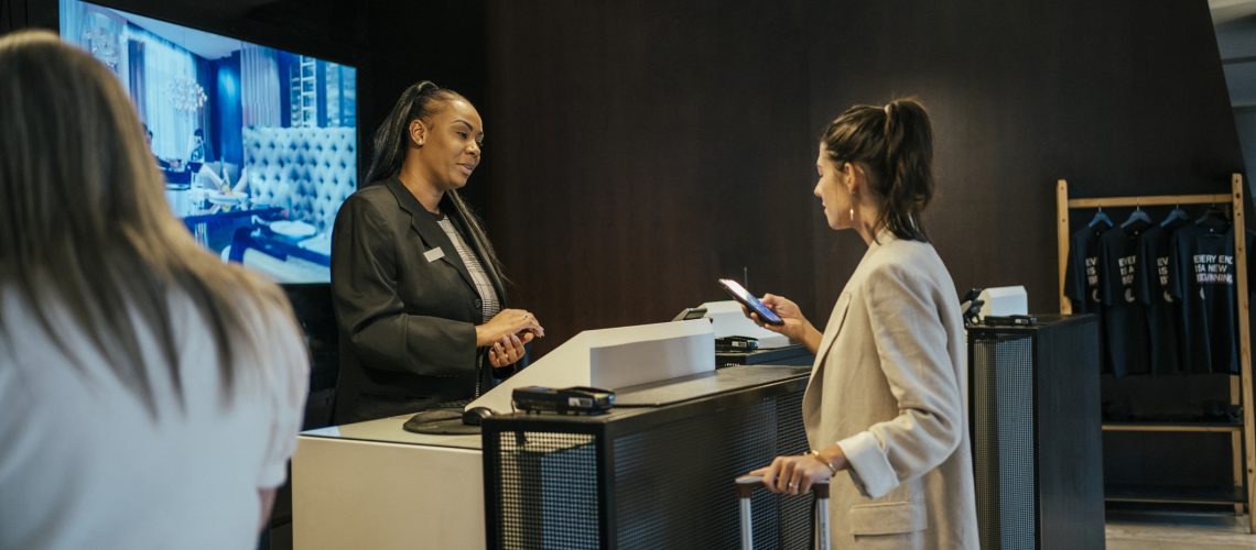 Businesswoman making check in at hotel