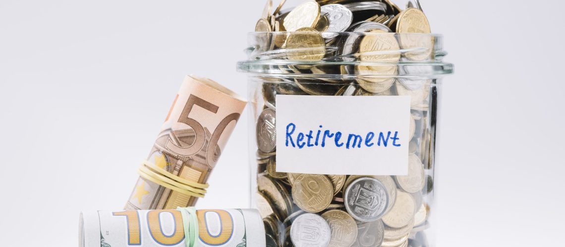 rolled-up-banknotes-retirement-container-full-coins-white-background